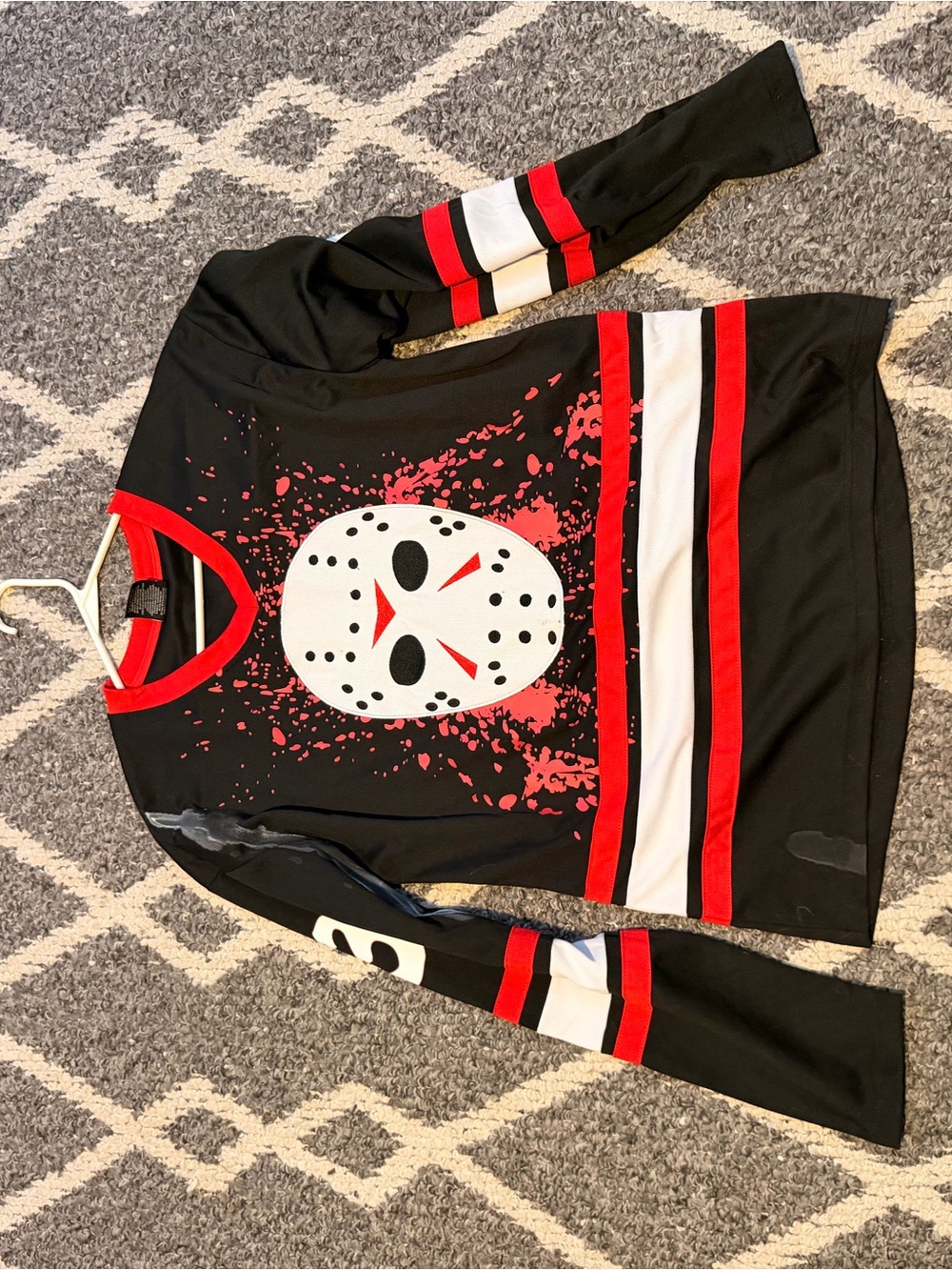 Black & Red Hockey-Style Sweatshirt with Mask Graphic